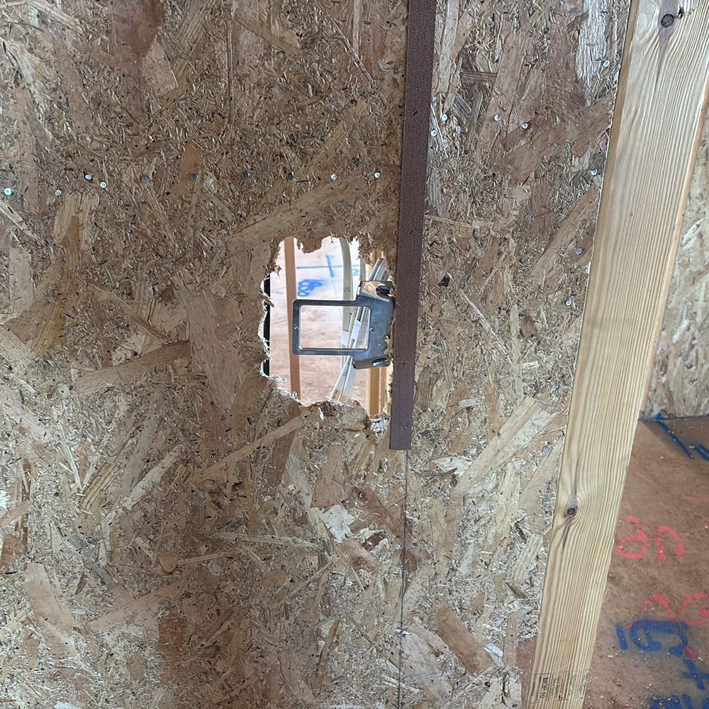 Structural bracing cut through by a later trade, needing repair and engineer sign off, found during a lock-up inspection in Strathtulloh