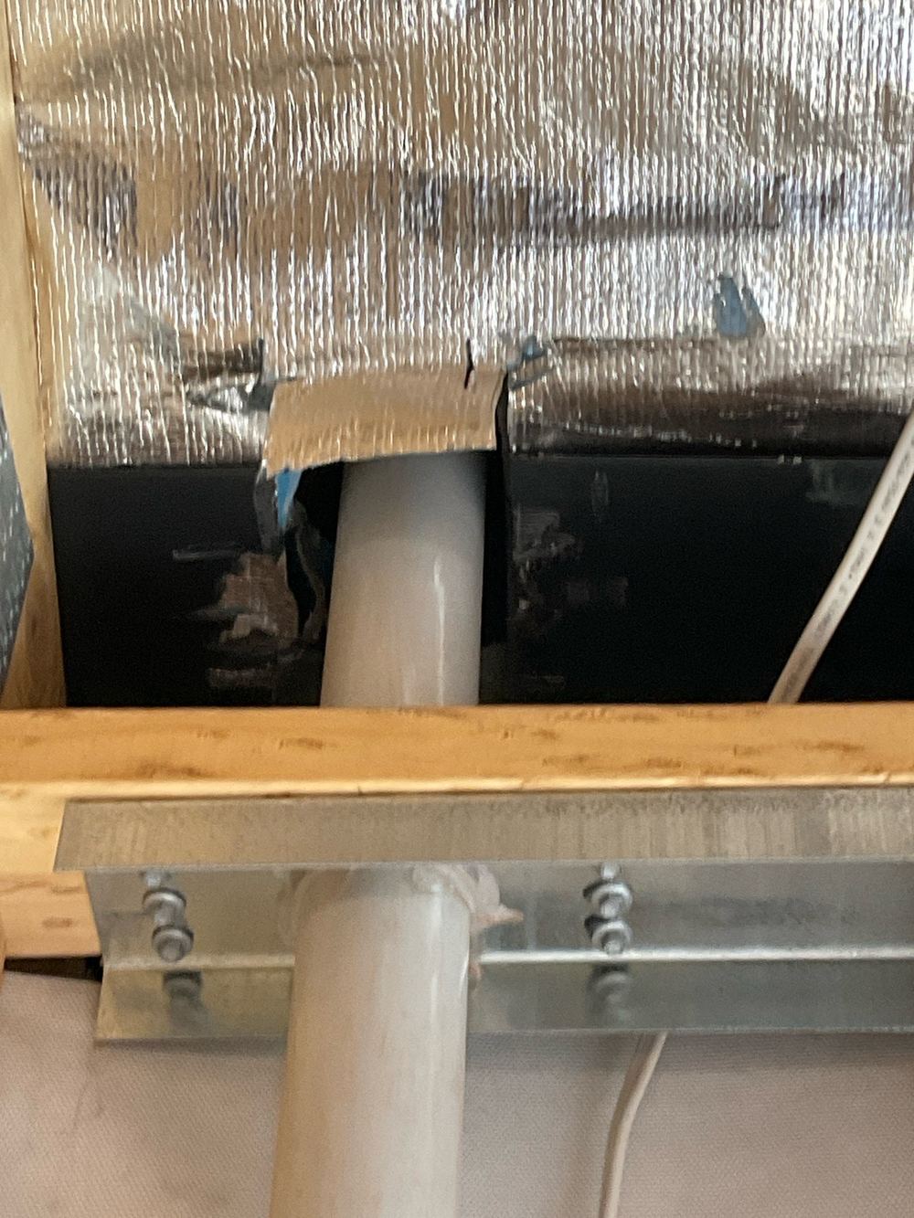Sarking left unsealed around a roof penetration, a direct path for water, found during a lock-up inspection in Strathtulloh