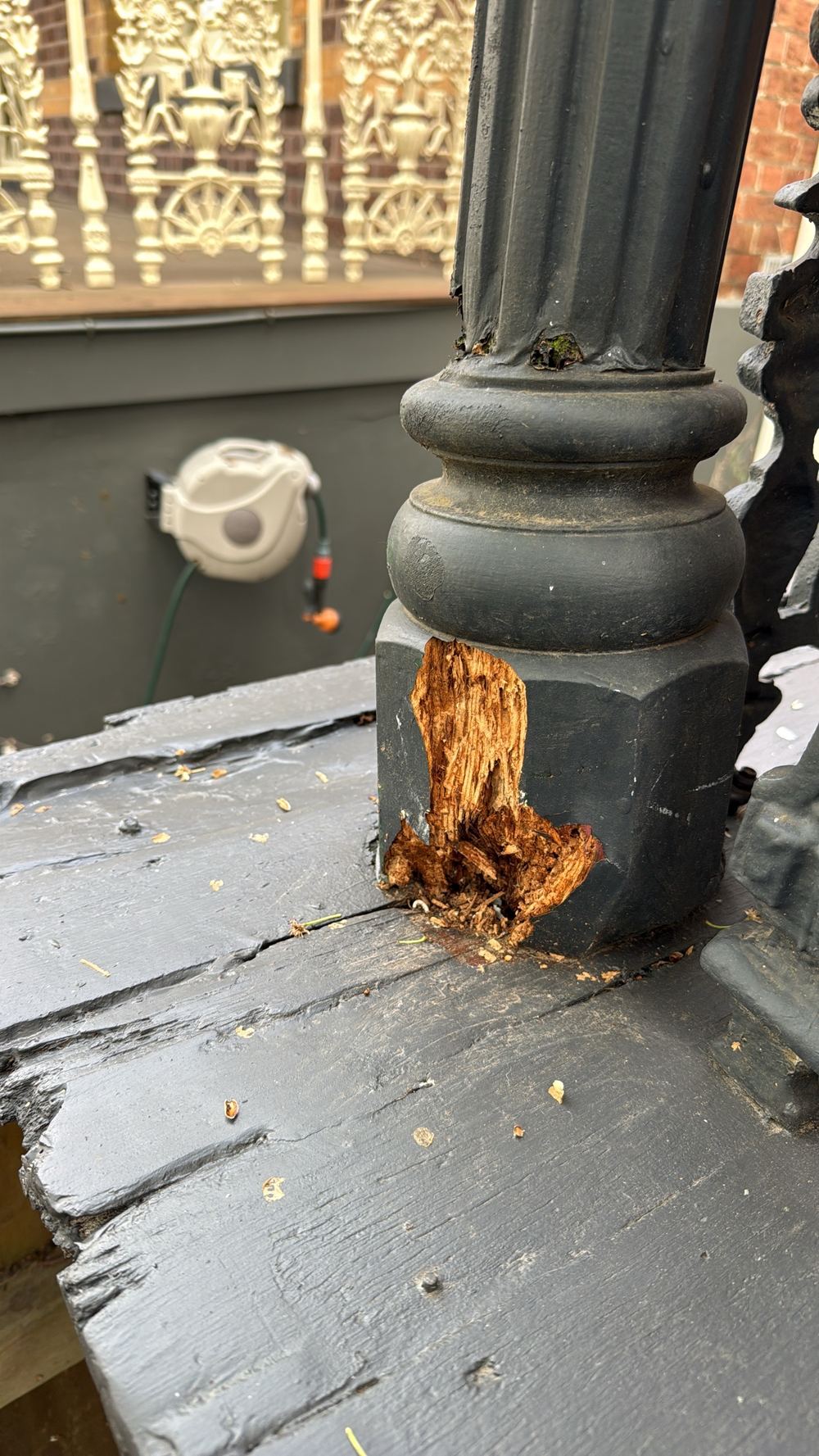 Structural post decayed at its base and patched over with filler, found during a pre-purchase inspection in Hawthorn