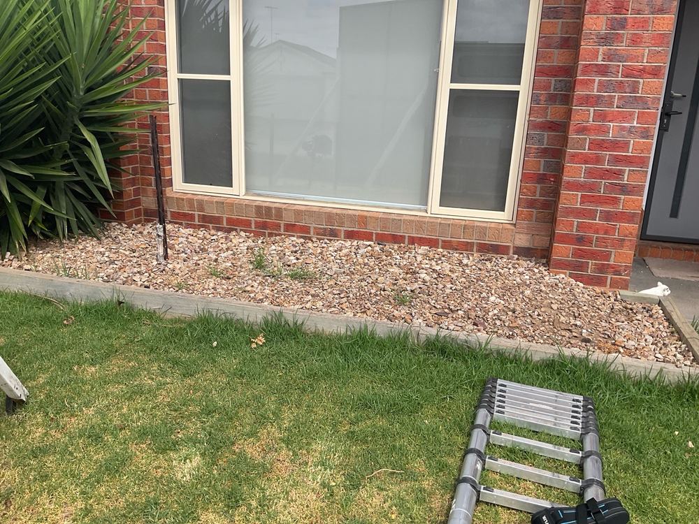 Weep holes buried at ground level across the front wall, found during a pre-purchase inspection in Lara