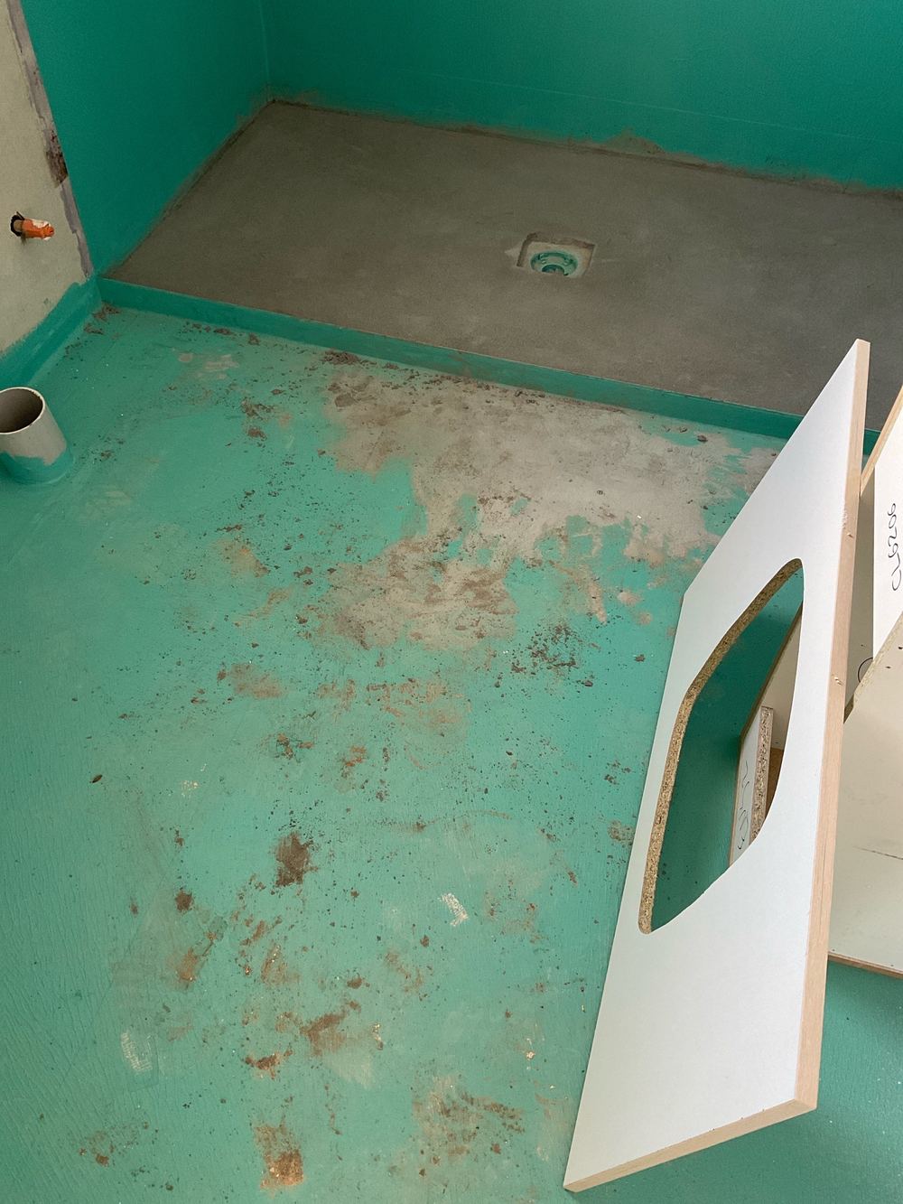 Fresh membrane on a shower floor left open to damage from other trades, Strathtulloh